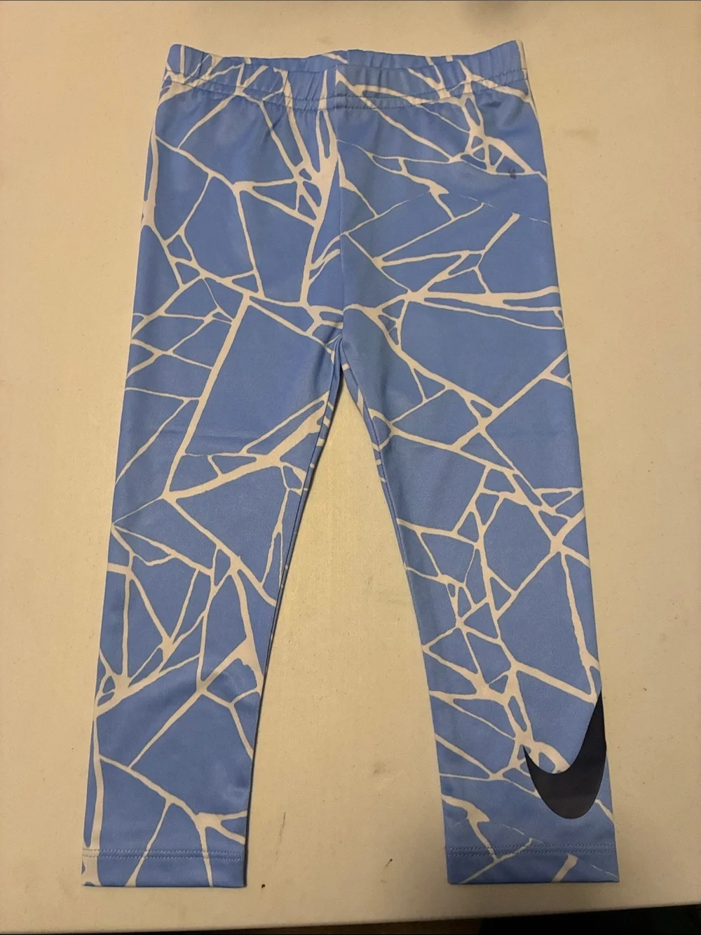 Nike Kids Light Blue & White Graphic Leggings with Black Swoosh